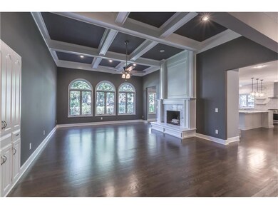 Living room with fireplace, wet bar, 12' ceilings 