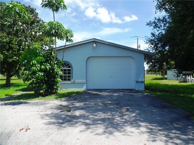 Detached garage and separate workshop with half ba