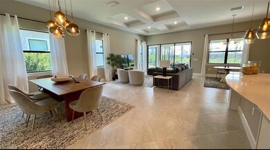 Dining room with a notable chandelier, beamed ceil