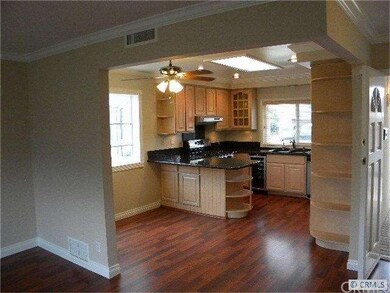 Kitchen from dining area and living room. Entry to