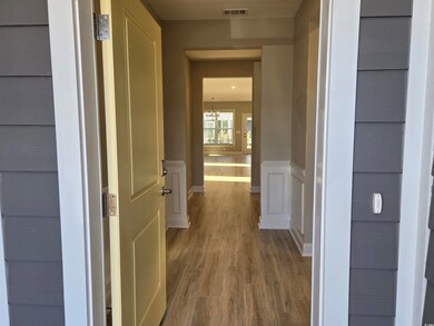 Hall featuring hardwood / wood-style flooring and 