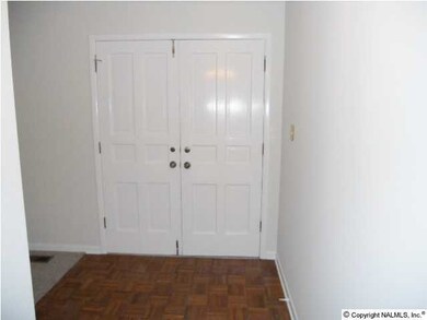The foyer has double doors .