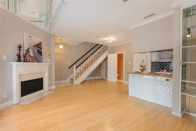 Unfurnished living room with a fireplace with flus