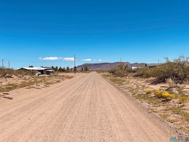 View of dirt / gravel road with a mountain view