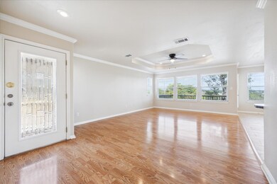 Unfurnished living room featuring light wood fini