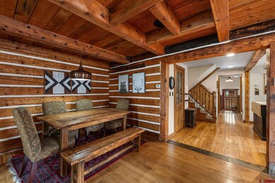 Dining room with ample seating. Adjacent to the kitchen and open to one of two living areas. You could make the entire space for dining.