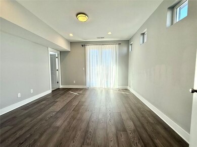 Unfurnished room with dark wood-type flooring, rec