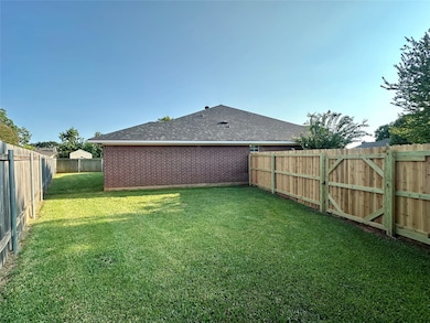 View of fenced backyard