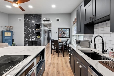 Kitchen with light wood-style floors, decorative 