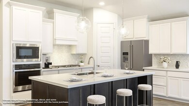 Kitchen with stainless steel appliances, a sink, 