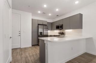 Kitchen featuring appliances with stainless steel