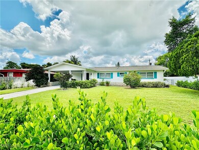 Ranch-style home featuring a carport and driveway