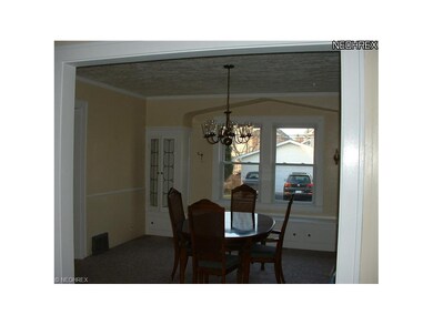 Dining room with large window seat that looks out 