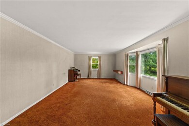 Huge living room with hardwoods underneath the car