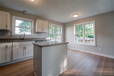 Kitchen with stainless steel dishwasher, white cab