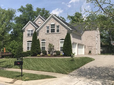 3 car side-entry garage, aggregate driveway.