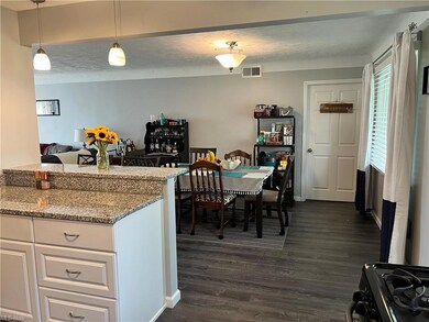 Kitchen looking into dining.