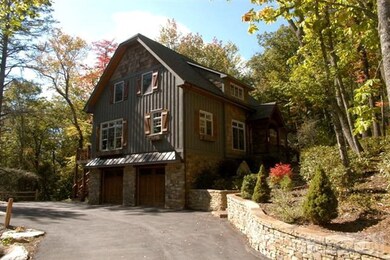 Home/Yard: Cultured stone walls, tree and shrub la