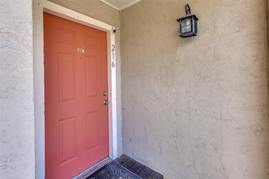 Entrance to property featuring stucco siding