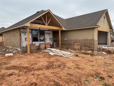 Unfinished property with brick siding, roof with s