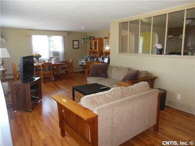 Living Room. Bright living room with refinished ha