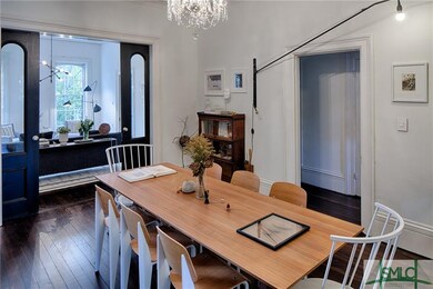 Dining room and living room with pocket doors betw