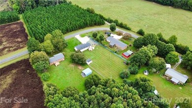 A few quiet neighbors, trees, and farmland make up