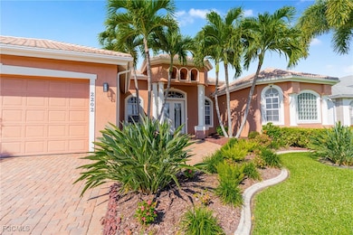 Featuring stucco siding, a tiled roof, an attached garage, and a front yard