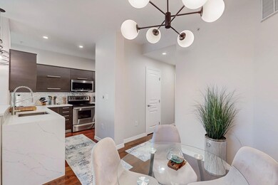Dining area featuring dark wood-style flooring, vi
