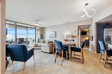 The open floor plan of the living, dining, and kit