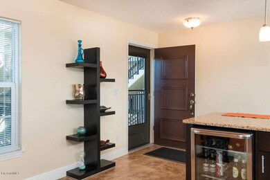Tiled front entry and beverage fridge