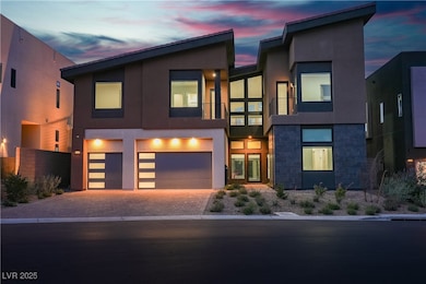 Contemporary home with a garage, stucco siding, dr