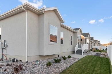 View of home's exterior featuring stucco siding and a residential view
