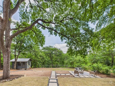 View of yard with an outdoor structure and a pati