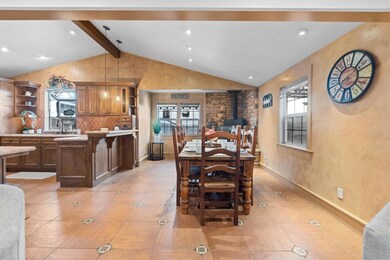Dining area and breakfast bar. Table and chairs in