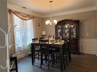 Dining space featuring dark hardwood / wood-style 