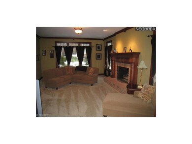 Sunken great room with fireplace and crown molding