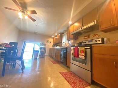 Kitchen featuring stainless steel dishwasher, ligh