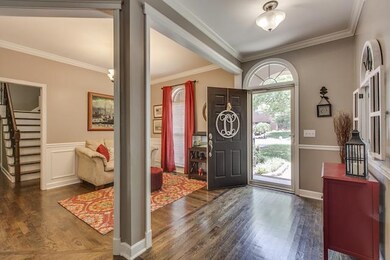 The open entry foyer with custom front door*custom