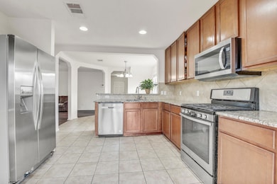 Kitchen featuring stainless steel appliances, a c