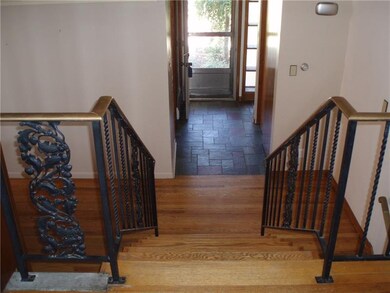 Stairs from living room to front door