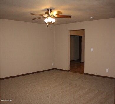 LARGE FRONT ROOM WITH CEILING FAN