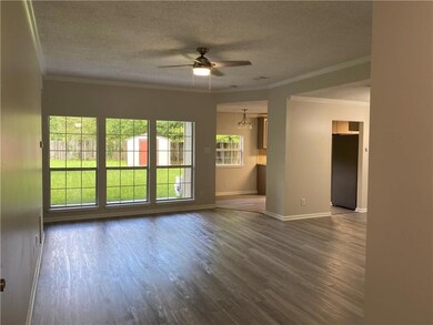 LIVING ROOM WITH WALL OF WINDOWS & OPEN FLOOR PLAN