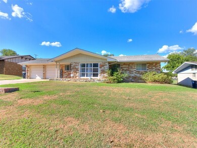 Ranch-style house with a garage and a front yard