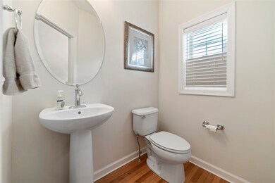 half bath located off the foyer.