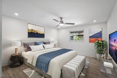 Bedroom with baseboards, wood finished floors, and