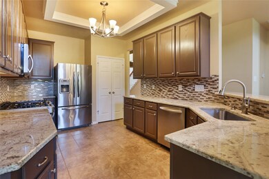 Gleaming gourmet kitchen.