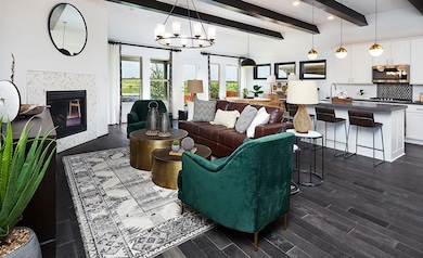 Living room featuring a high end fireplace, beam 