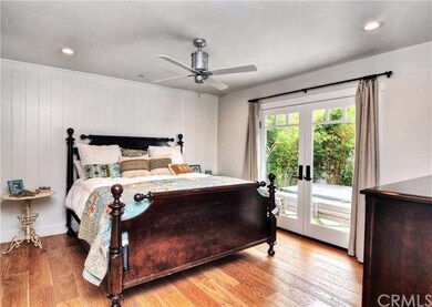 Master bedroom with large custom walk-in closet an