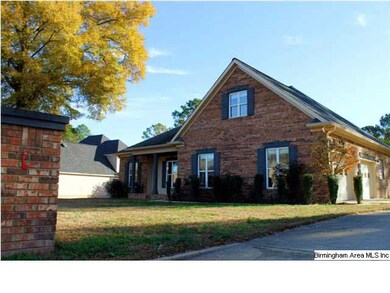 The 2-car garage enters from the side.